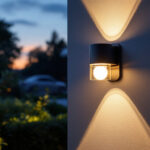 A photograph of a beautifully illuminated outdoor wall light installed on a home exterior