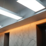 A photograph of capture a photograph of a modern interior space featuring architectural square linear lights