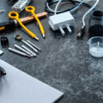 A photograph of a well-organized workspace featuring various electrical supplies