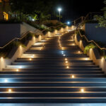A photograph of a well-lit outdoor stairway showcasing stylish lighting fixtures