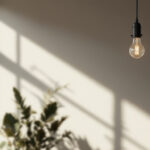 A photograph of a beautifully designed industrial-style lighting fixture in a modern interior setting