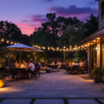 A photograph of a beautifully illuminated outdoor patio at dusk