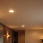 A photograph of a beautifully designed room featuring recessed can lights