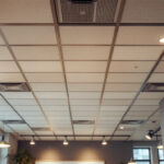 A photograph of a well-lit drop ceiling installation in a commercial space