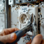 A photograph of capture a photograph of a close-up view of a dryer power receptacle being installed or inspected by a lighting contractor