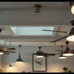 A photograph of a well-lit interior space showcasing a variety of stylish ceiling fans in use
