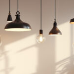 A photograph of a stylishly designed space featuring a variety of hanging pendant lights