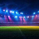 A photograph of a vibrant stadium illuminated by powerful led lights during a night event
