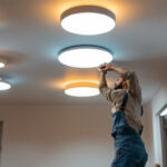 A photograph of a well-lit room showcasing various styles of ceiling can lights in action