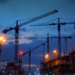 A photograph of a construction site at dusk