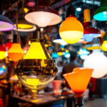 A photograph of a vibrant display of various metal halide lamps in a well-lit environment