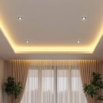 A photograph of a modern ceiling featuring stylish recessed can lights