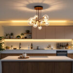 A photograph of a modern kitchen featuring an elegant ceiling light fixture that highlights the space