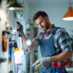 A photograph of a skilled electrician at work