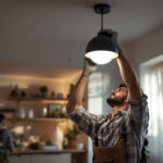 A photograph of a skilled lighting contractor installing a modern ceiling light fixture in a beautifully designed room