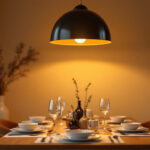 A photograph of a beautifully set dining room featuring an elegant ceiling lamp that enhances the ambiance