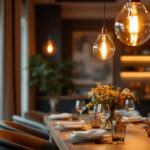 A photograph of a stylish dining room featuring elegant hanging lights that create a warm and inviting atmosphere