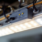 A photograph of a close-up of a led light ballast installed in a modern lighting fixture