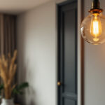 A photograph of a beautifully designed pendant light fixture hanging in an aesthetically pleasing interior setting
