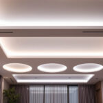 A photograph of a modern ceiling with sleek recessed led lights illuminating a stylish interior space