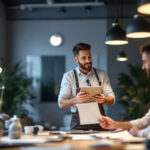 A photograph of a skilled lighting contractor engaging with clients in a well-lit space