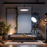 A photograph of a modern lighting contractor installing circle lights in a well-lit space