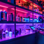 A photograph of a beautifully lit shelf displaying various items under uv lights