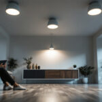 A photograph of a well-lit modern room featuring sleek can lights installed in the ceiling