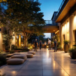 A photograph of a well-lit outdoor space showcasing various lighting installations