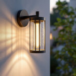 A photograph of a beautifully designed outdoor wall mount light illuminating a stylish outdoor space