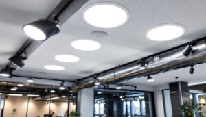 A photograph of a well-lit commercial space featuring recessed light fixtures installed in a suspended ceiling