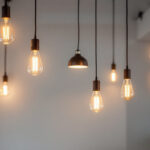 A photograph of a beautifully designed space featuring hanging led lights in various styles and arrangements