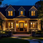 A photograph of a beautifully illuminated exterior of a house at dusk