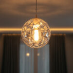 A photograph of a beautifully designed ceiling hung light fixture in an aesthetically pleasing room setting