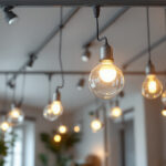 A photograph of a well-lit interior space featuring various styles of track lighting installations