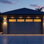 A photograph of a well-lit garage exterior at dusk