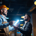 A photograph of a lighting contractor showcasing a vibrant 8-foot led light installation in a commercial space