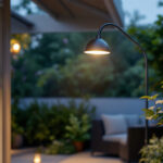 A photograph of capture a photograph of an elegant exterior gooseneck lamp illuminating a charming outdoor space at dusk