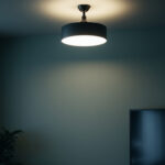 A photograph of a well-lit room with low ceilings