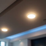 A photograph of a well-lit t-bar ceiling featuring recessed lights