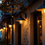 A photograph of a well-lit exterior space showcasing stylish black outdoor lights illuminating a commercial building
