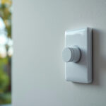 A photograph of a close-up of a single pole switch being installed by a contractor in a residential setting