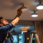 A photograph of a skilled lighting contractor expertly replacing recessed lighting fixtures with modern led options