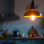 A photograph of a beautifully designed hanging kitchen light fixture illuminating a cozy kitchen space