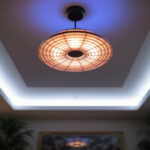 A photograph of a beautifully designed ceiling lamp in a well-lit interior setting