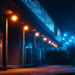 A photograph of a vibrant 100-foot led light installation illuminating a dark outdoor space