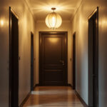A photograph of a stylish small hallway featuring an elegant light fixture that highlights the space's design and enhances the overall ambiance