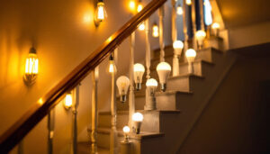 A photograph of a well-lit staircase featuring various types of energy-efficient light bulbs