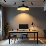 A photograph of a stylish home office featuring a modern ceiling light that highlights the workspace
