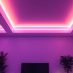 A photograph of a beautifully lit room featuring sleek led strip lights installed along the ceiling